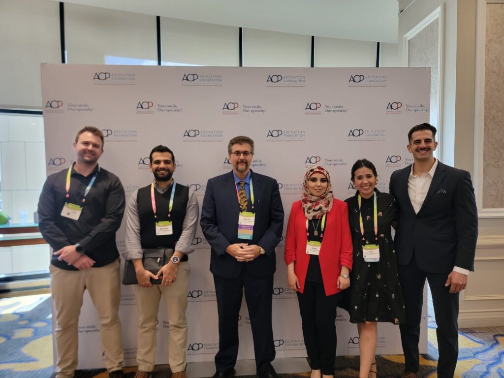 Dr. Justin W. Nichols with fellow prosthodontic residents and their program director at the American College of Prosthodontists annual session